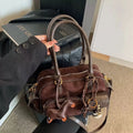 Bolso Baguette Lujan en tonos tierra
